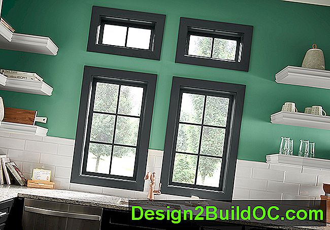 fire sorte vinduer over køkkenvask og bordplade med vægmalet jadegrøn